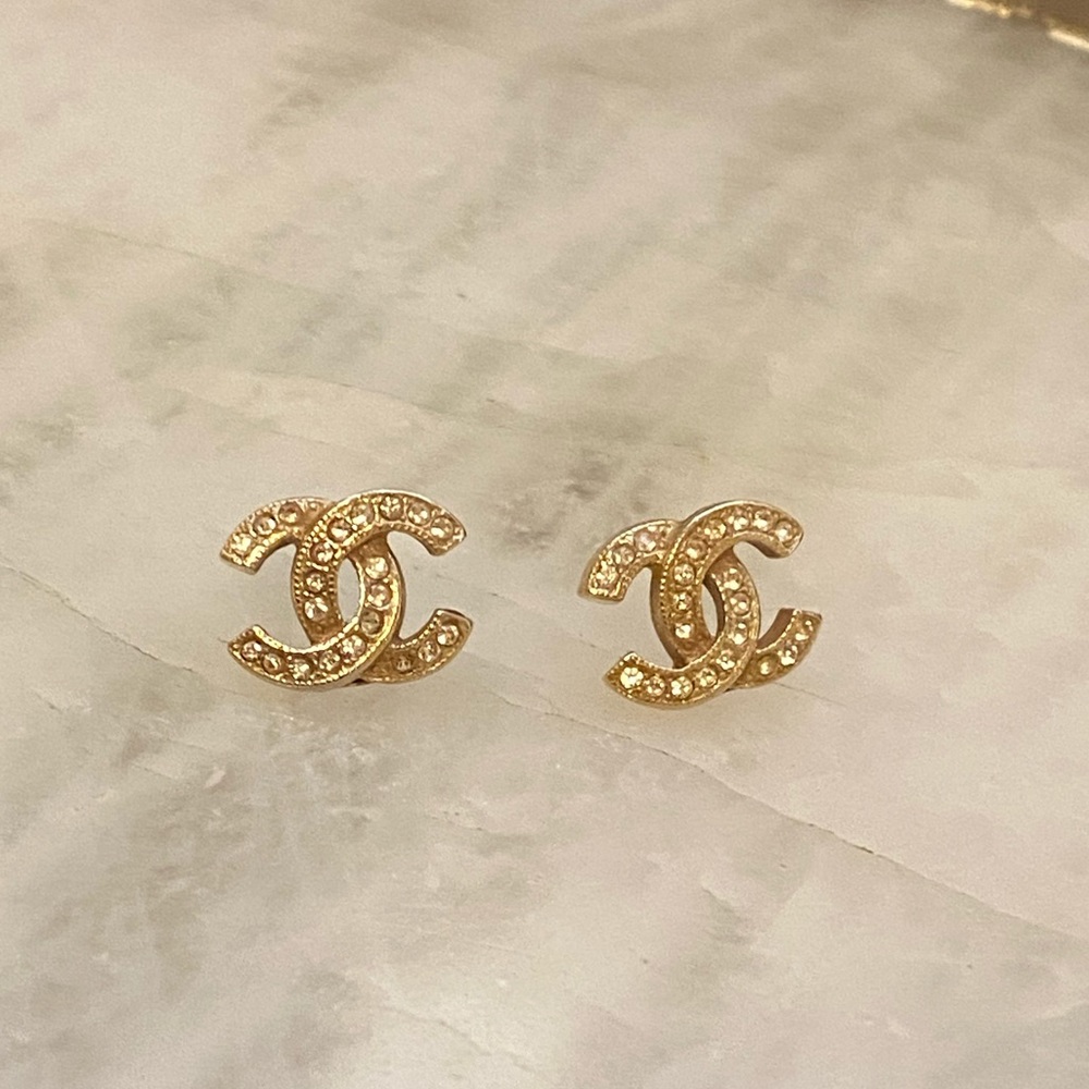 CHANEL - gold tone crystal logo earrings